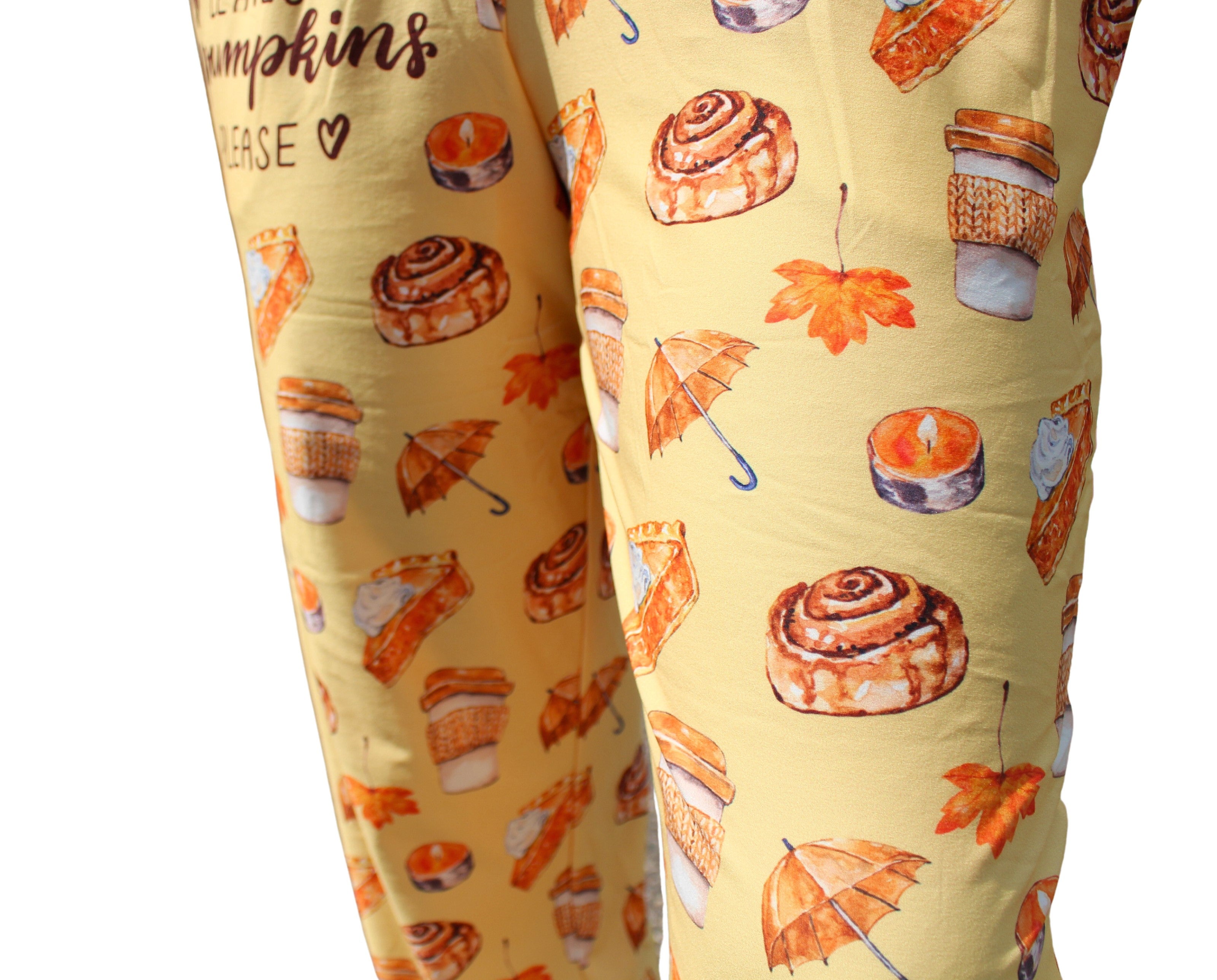 Autumn Leaves and Pumpkins Please Pajama Lounge Pants close up view of pattern (Cinnabons, orange leafs, orange umbrellas, coffee cups, candles, pumpkin pies )
