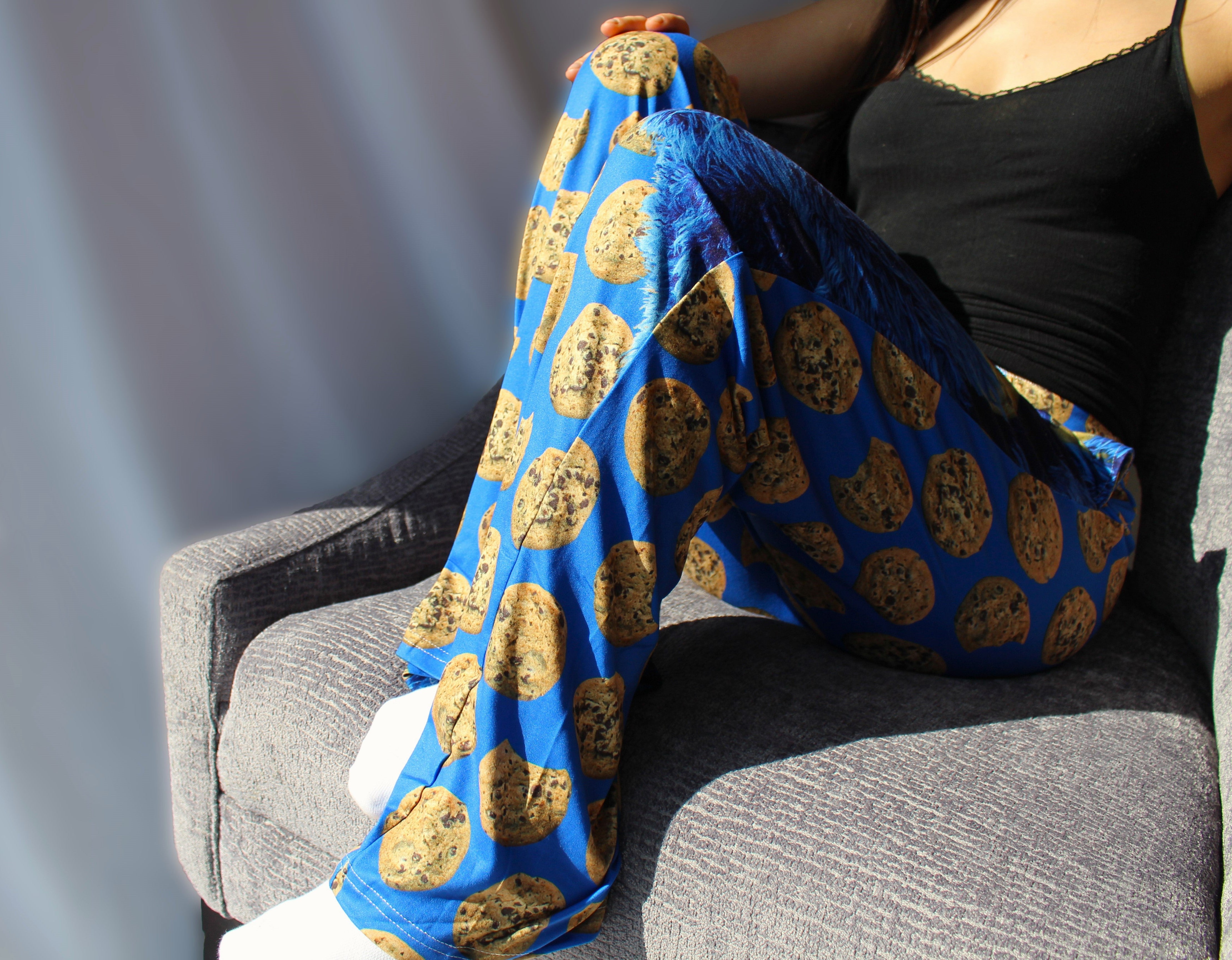 Cookie Monster pants on model sitting on chair with legs up - side view