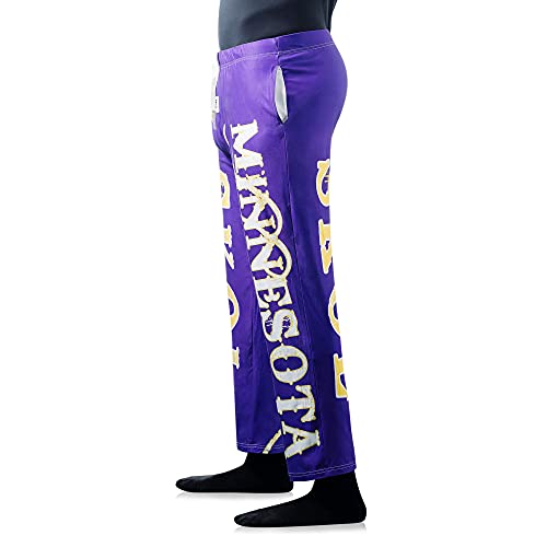 Waist down photo of model wearing SKOL pajama lounge pants side view (white background)
