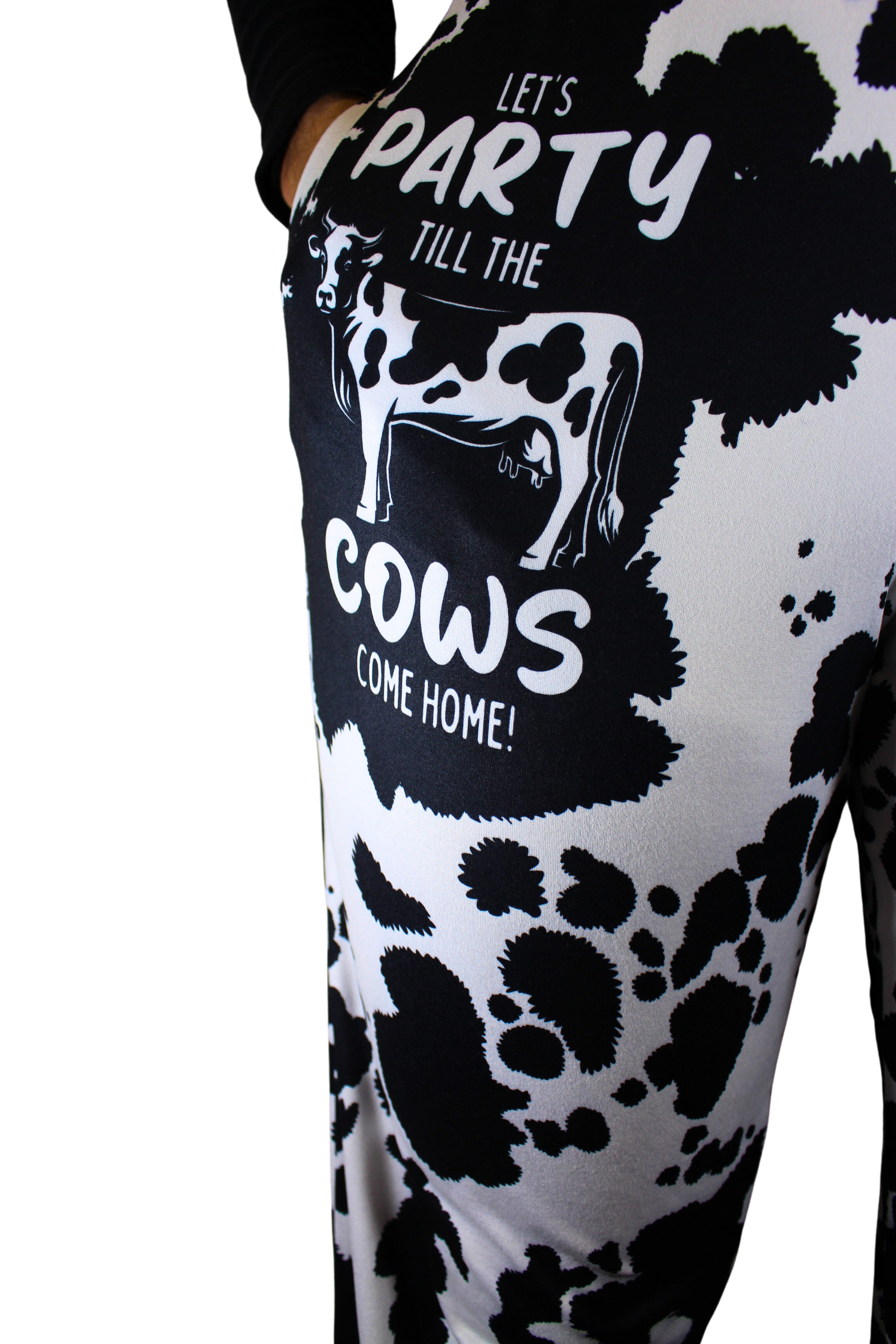Party 'Till The Cows Come Home pajama lounge pants on model showing one leg (close up front view with hand in pocket)