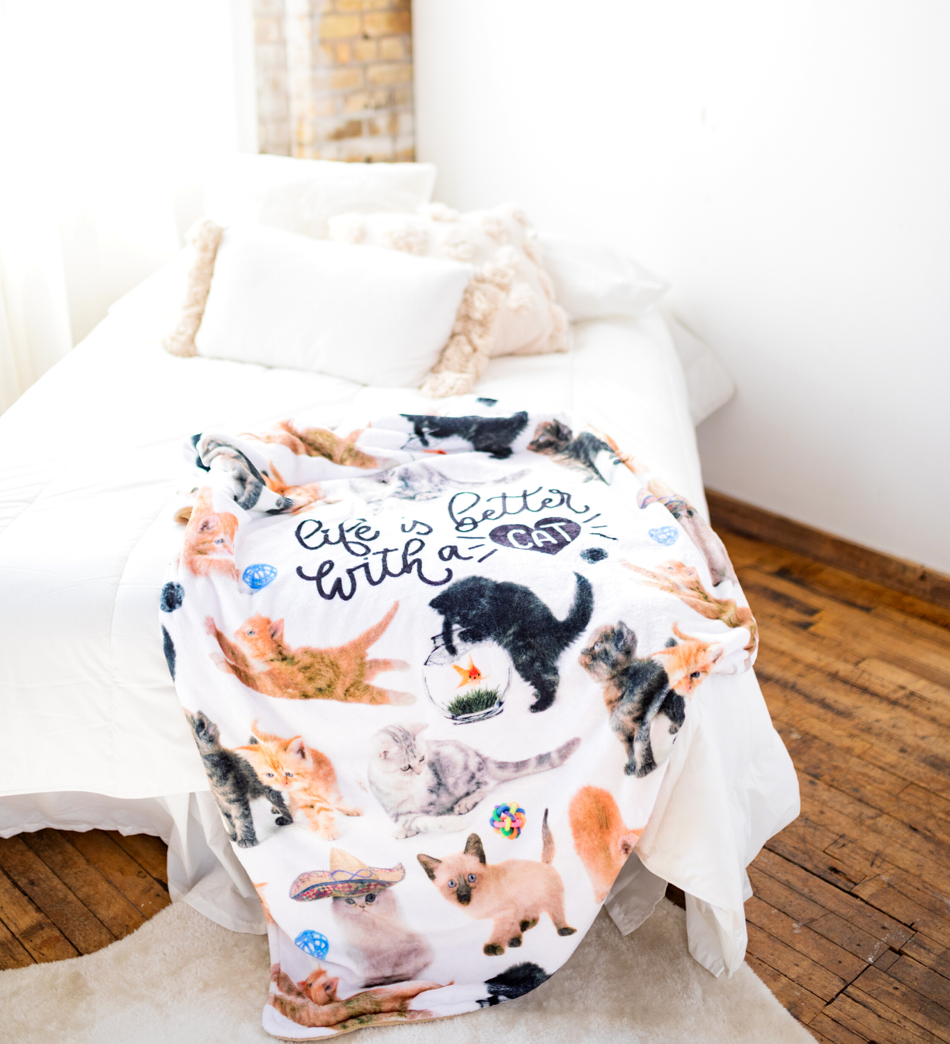BRIEF INSANITY Life Is Better with A Cat Throw Blanket laid out on edge of white bed