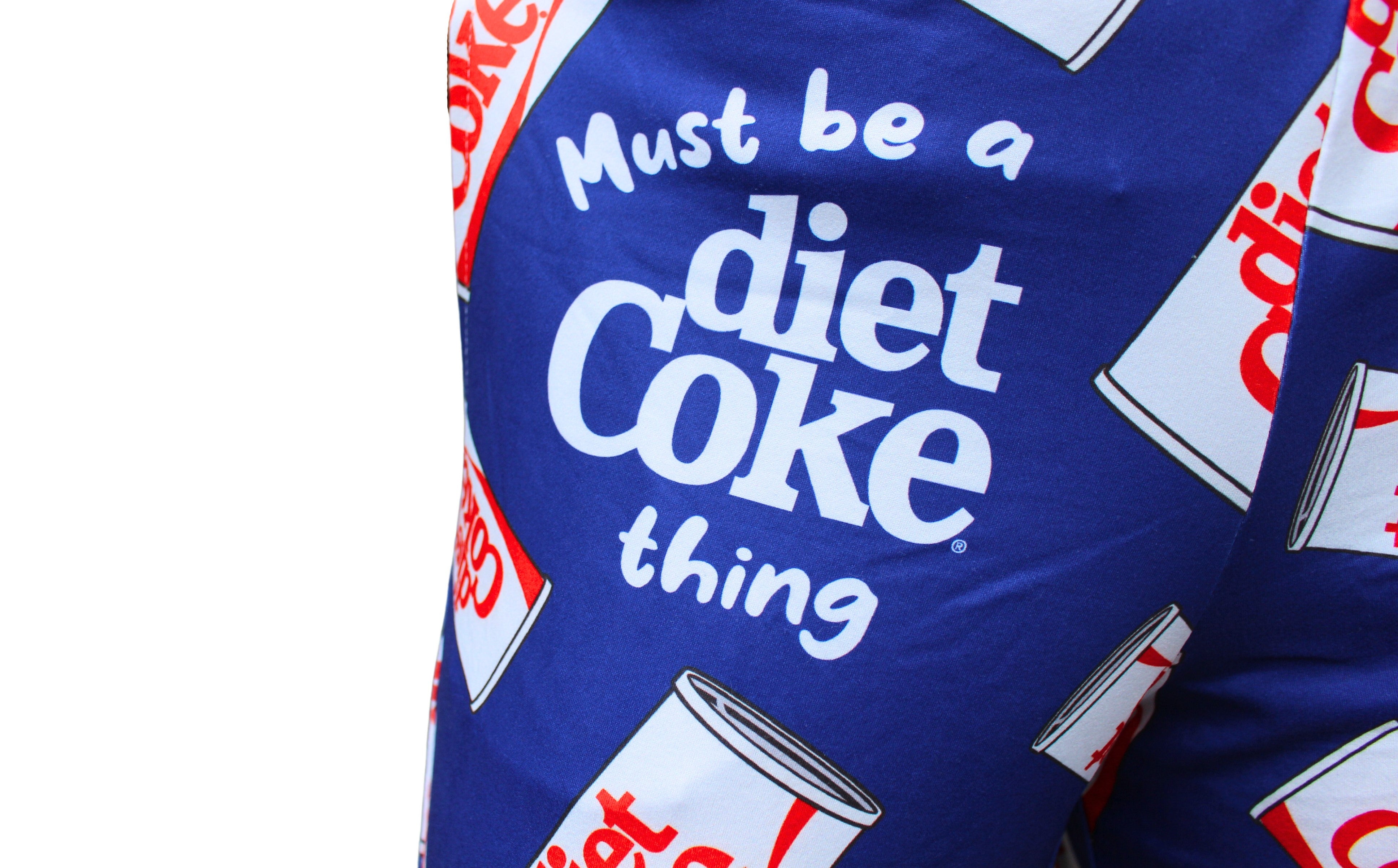 Diet Coke Pajama Lounge Pants on model close up view of text on upper right pant