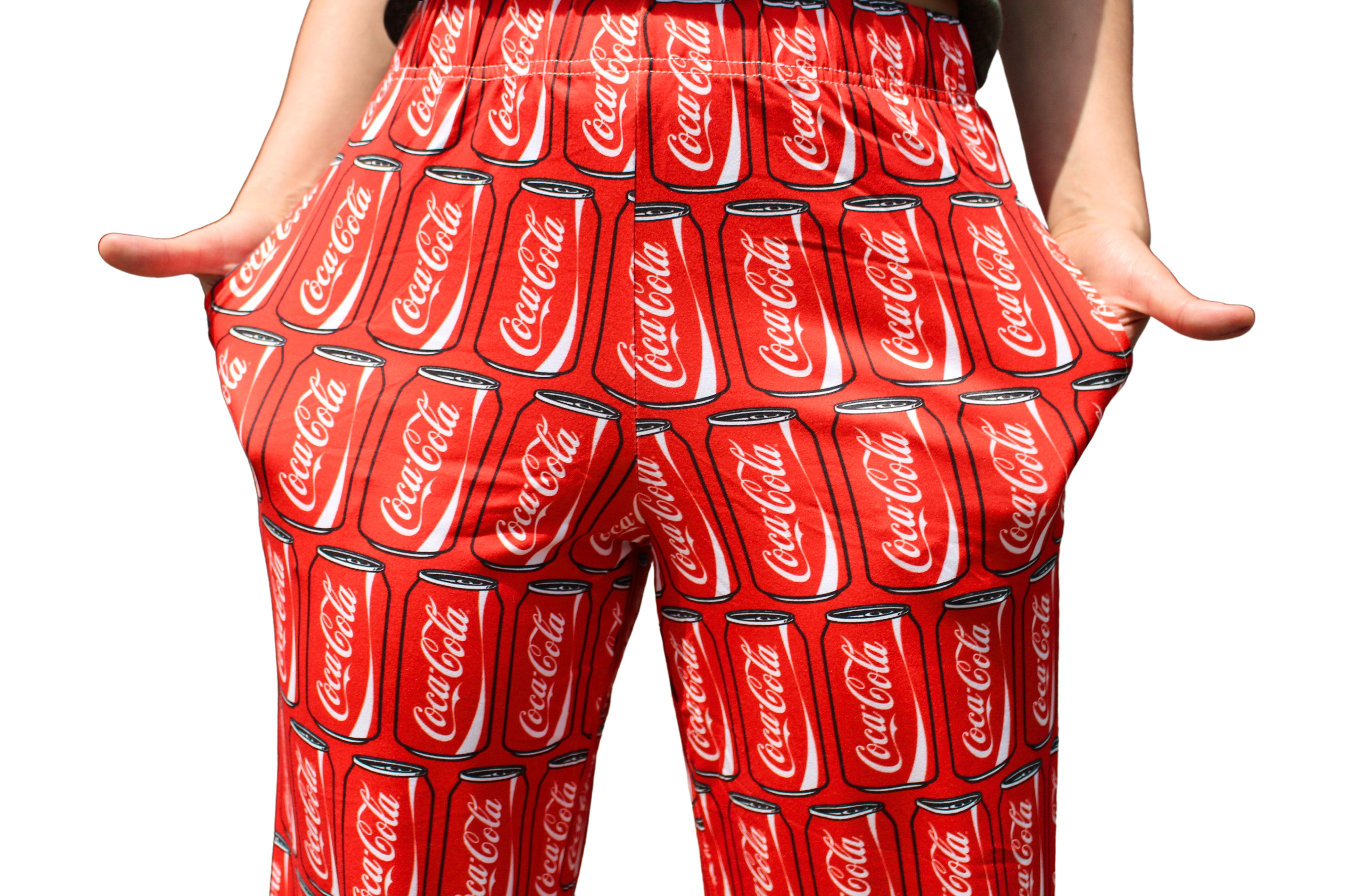 Coca-Cola Can Pattern Pajama Lounge Pants on model close up front view (waist to midway down pants)