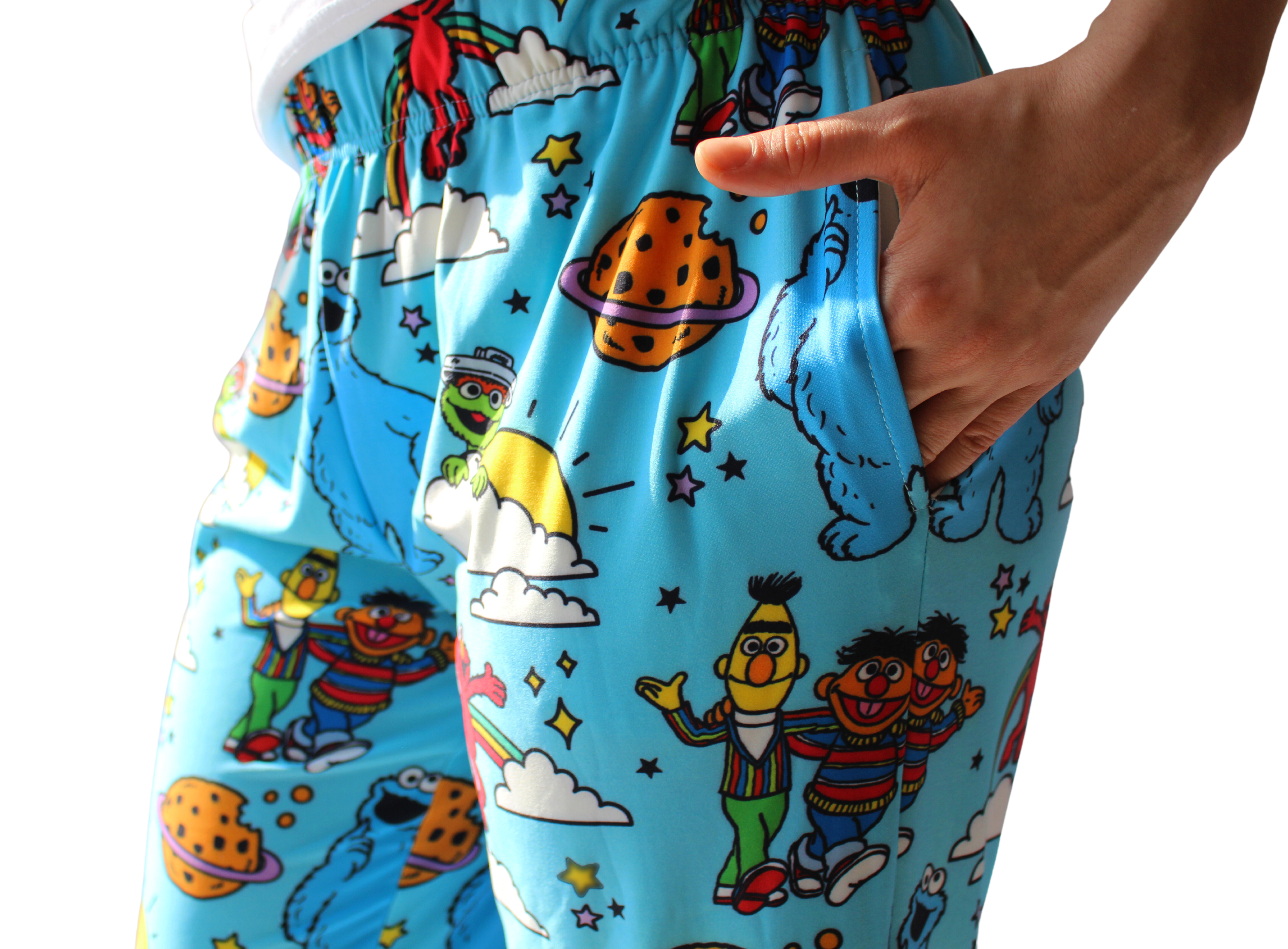Sesame Street Characters pants on model with hand in pocket close up view