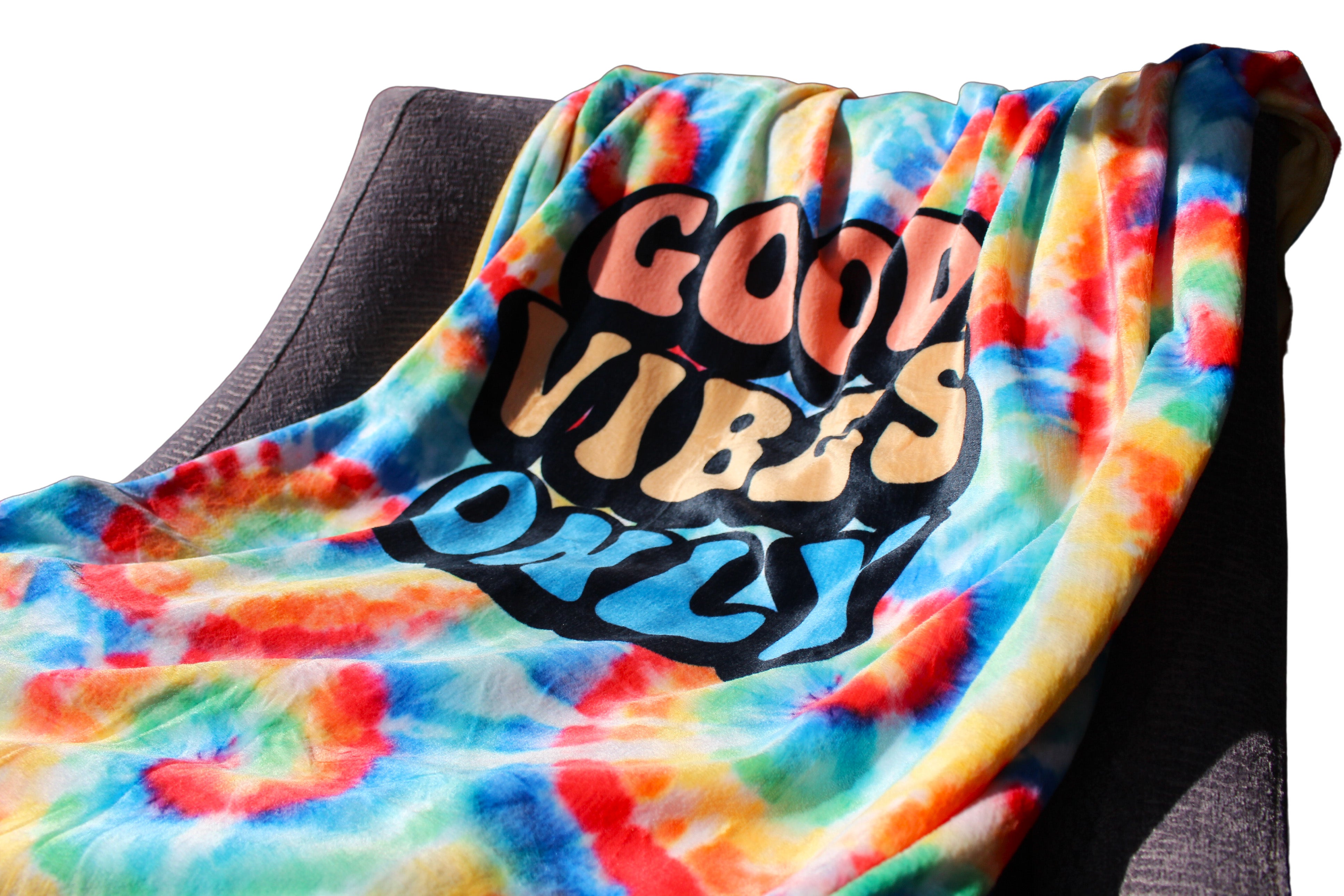 Good Vibes Only blanket laid out on chair