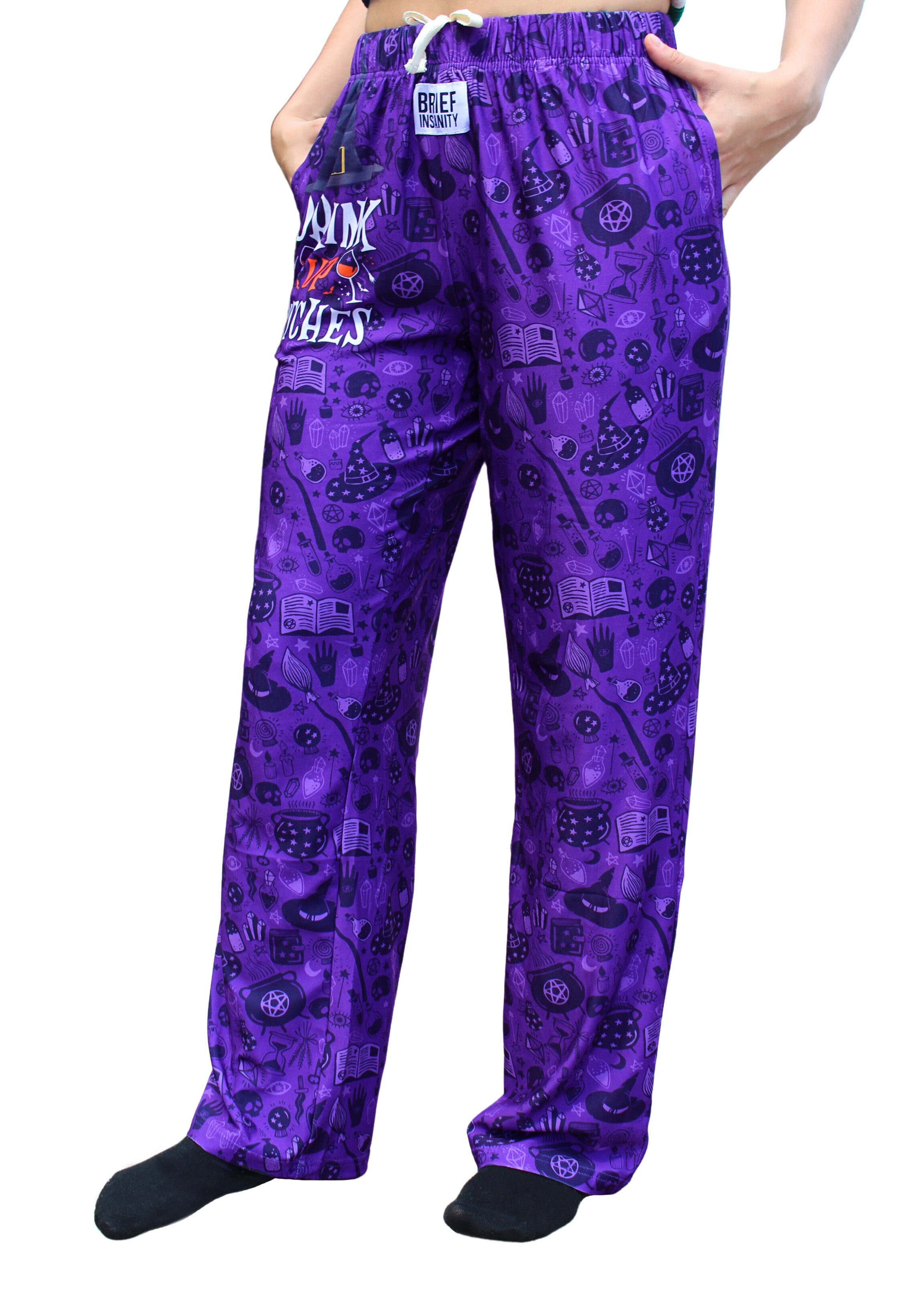 Drink Up Witches Pajama Lounge Pants left side view on model (waist down)