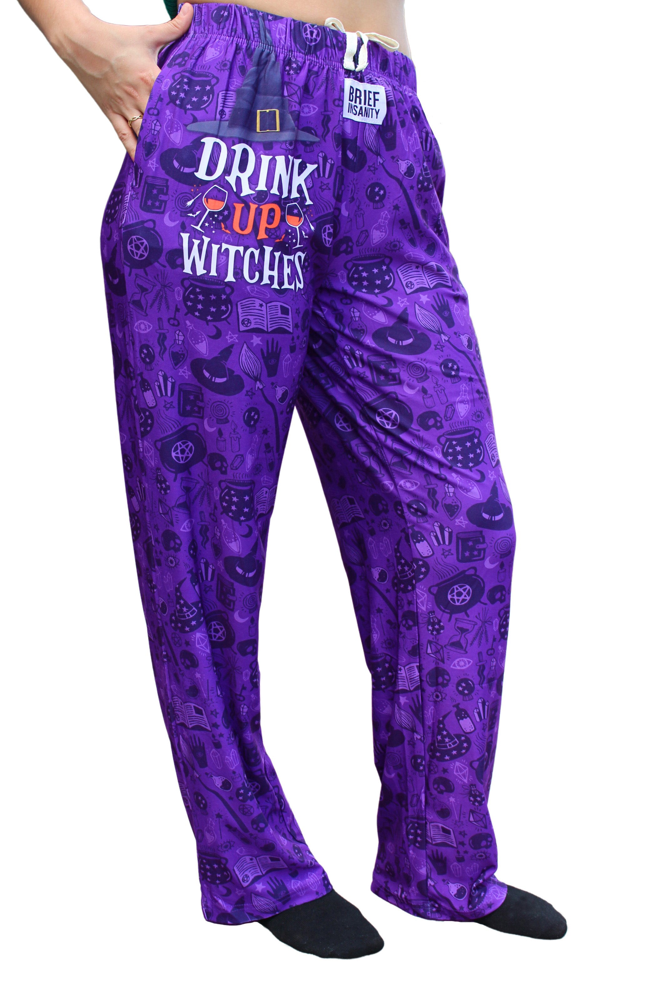 Drink Up Witches Pajama Lounge Pants right side view on model (waist down)