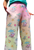 Person showing pockets on BRIEF INSANITY Snoopy Beach Pajama Lounge Pants
