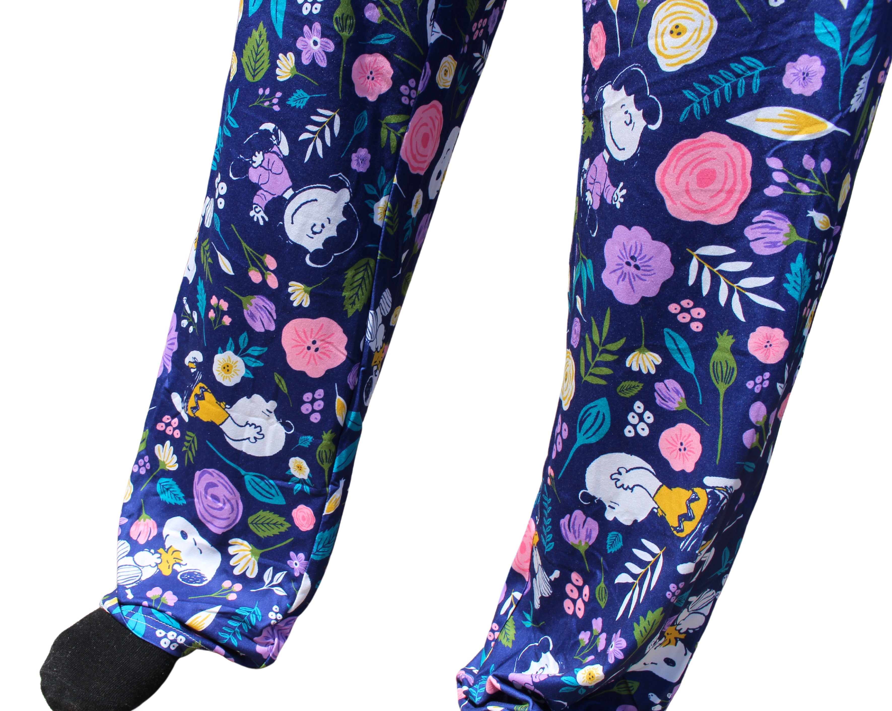 Snoopy Floral Love pajama lounge pants on model close up view of graphic pattern at bottom of legs
