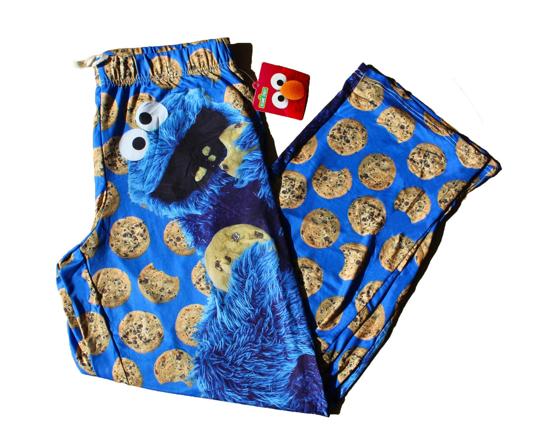Cookie Monster pants laid out with white background