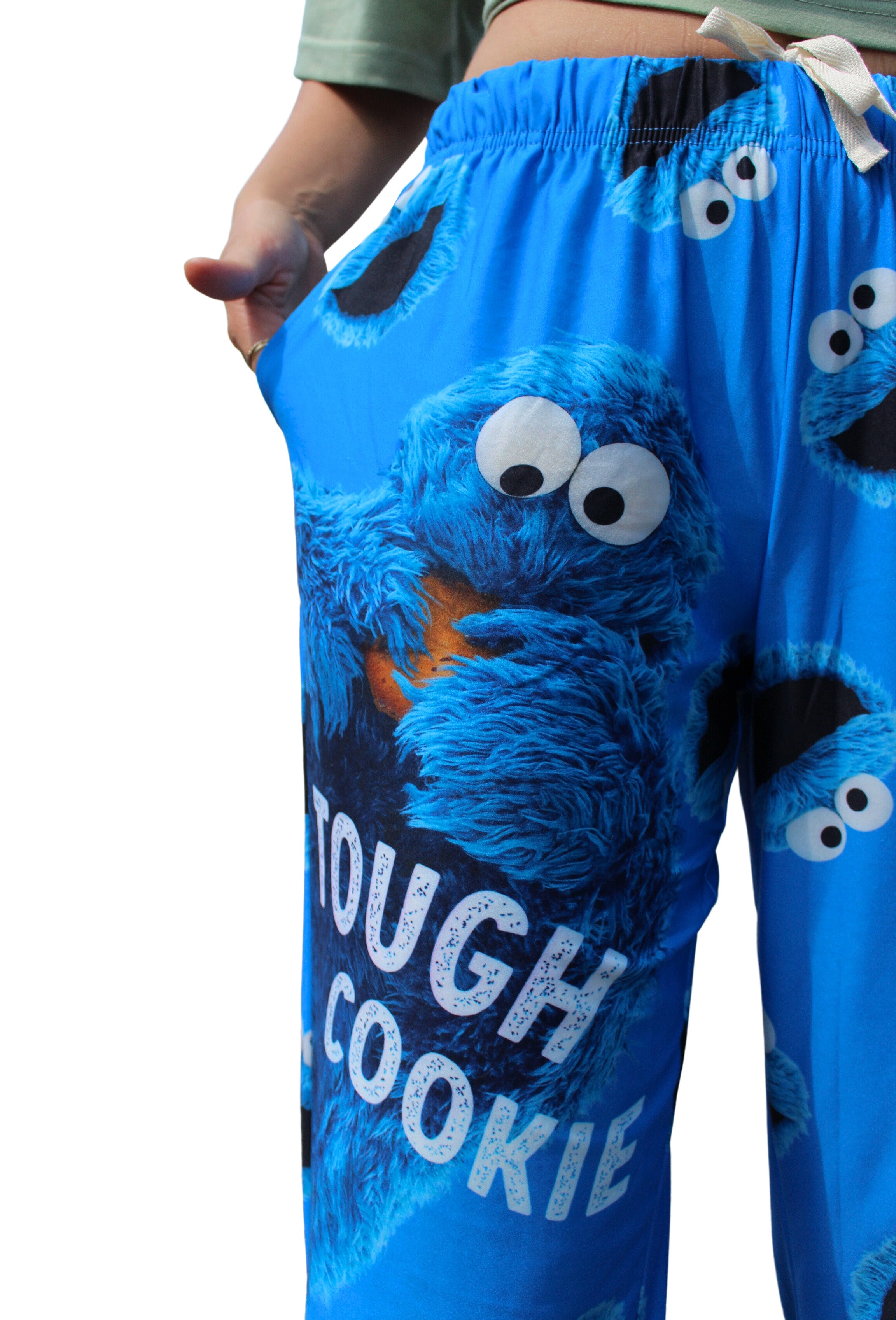 Tough Cookie Pajama Lounge Pants close up view of big cookie monster graphic with "tough cookie" text