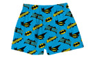 Batman Logos Blue Boxer Shorts featuring vibrant yellow Batman logos and bold 'BATMAN' text in black and blue on a bright blue background – Warner Bros. Discovery.