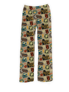 Looney Tunes Camping Pajama Pants featuring colorful outdoor-themed patches and character designs on a tan background – Warner Bros. Discovery.