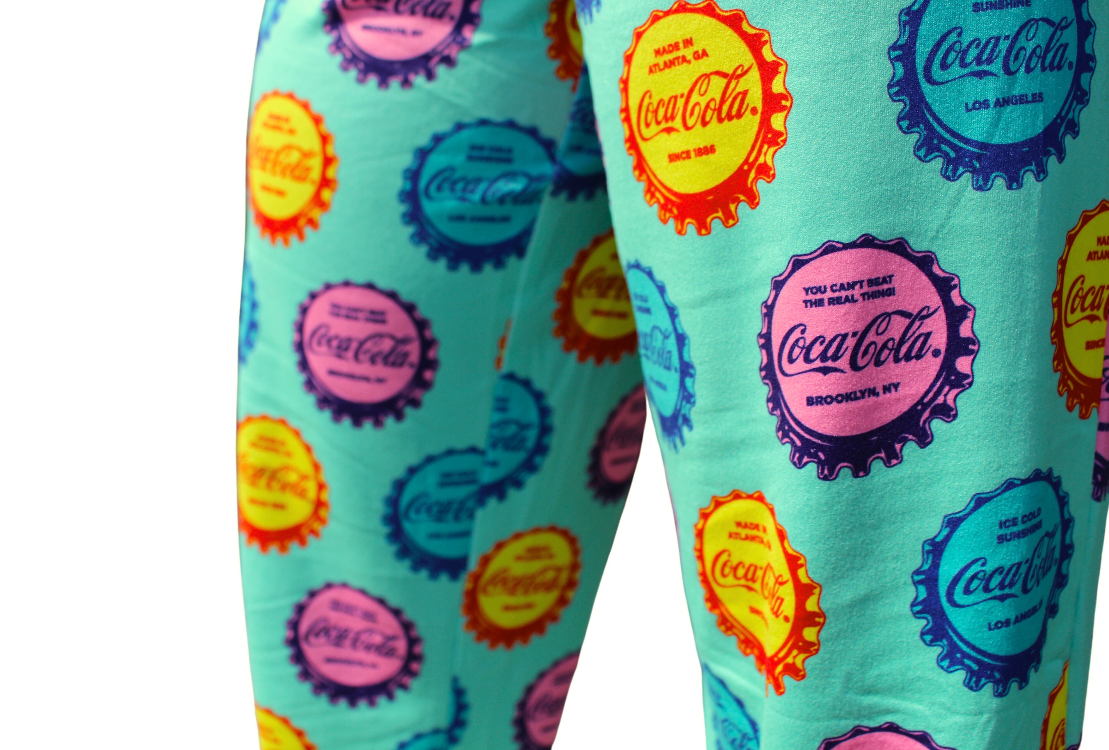 Coca-Cola Cap Pattern Pajama Lounge Pants on model close up view of cap pattern