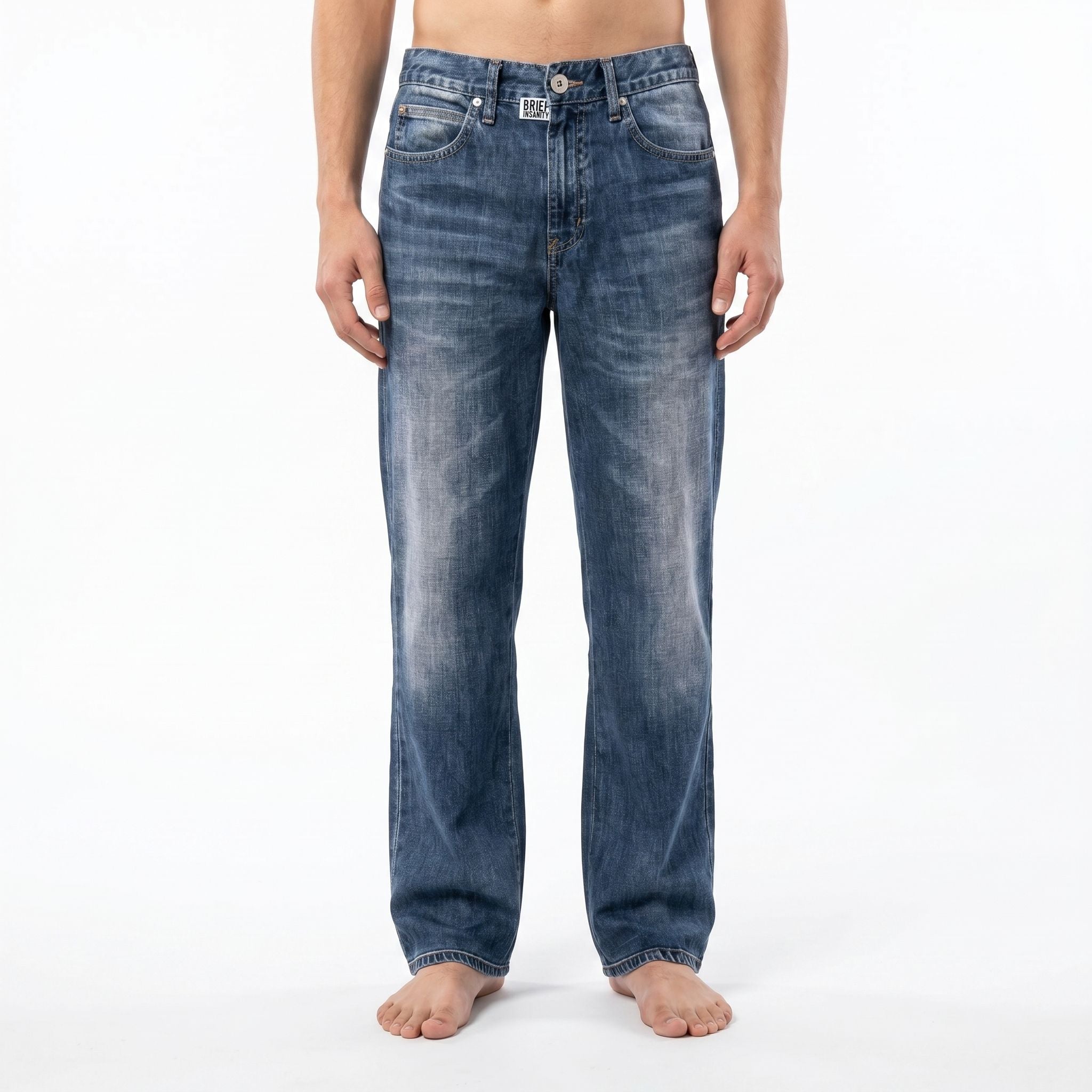 Model wearing blue jeans illusion lounge pants against a white background, showcasing the casual design and fit.
