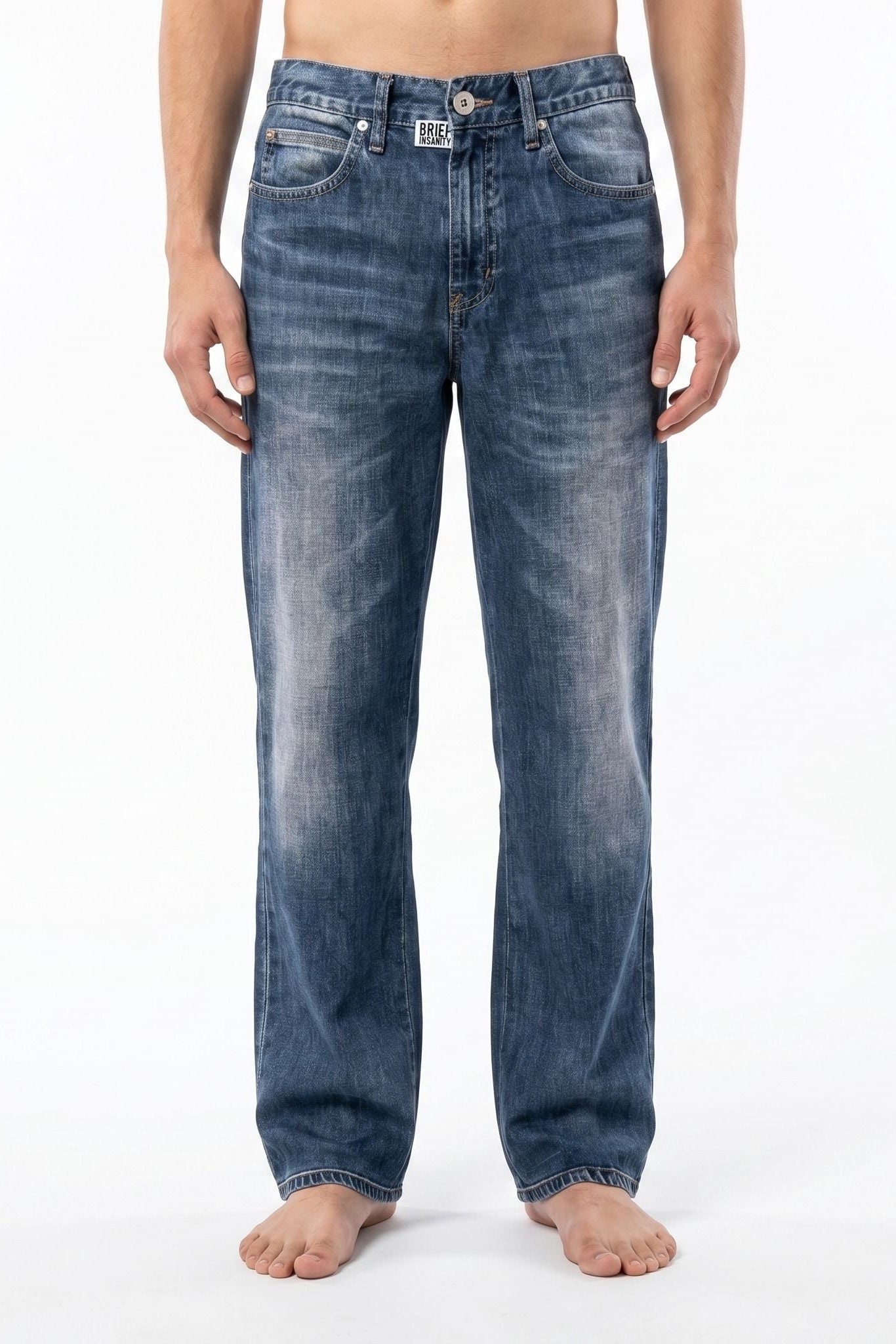 Model wearing blue jeans illusion lounge pants against a white background, showcasing the casual design and fit.