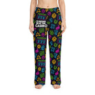 Unisex lounge pants featuring neon casino symbols like dice and lucky 7s on a black background, worn by a model.