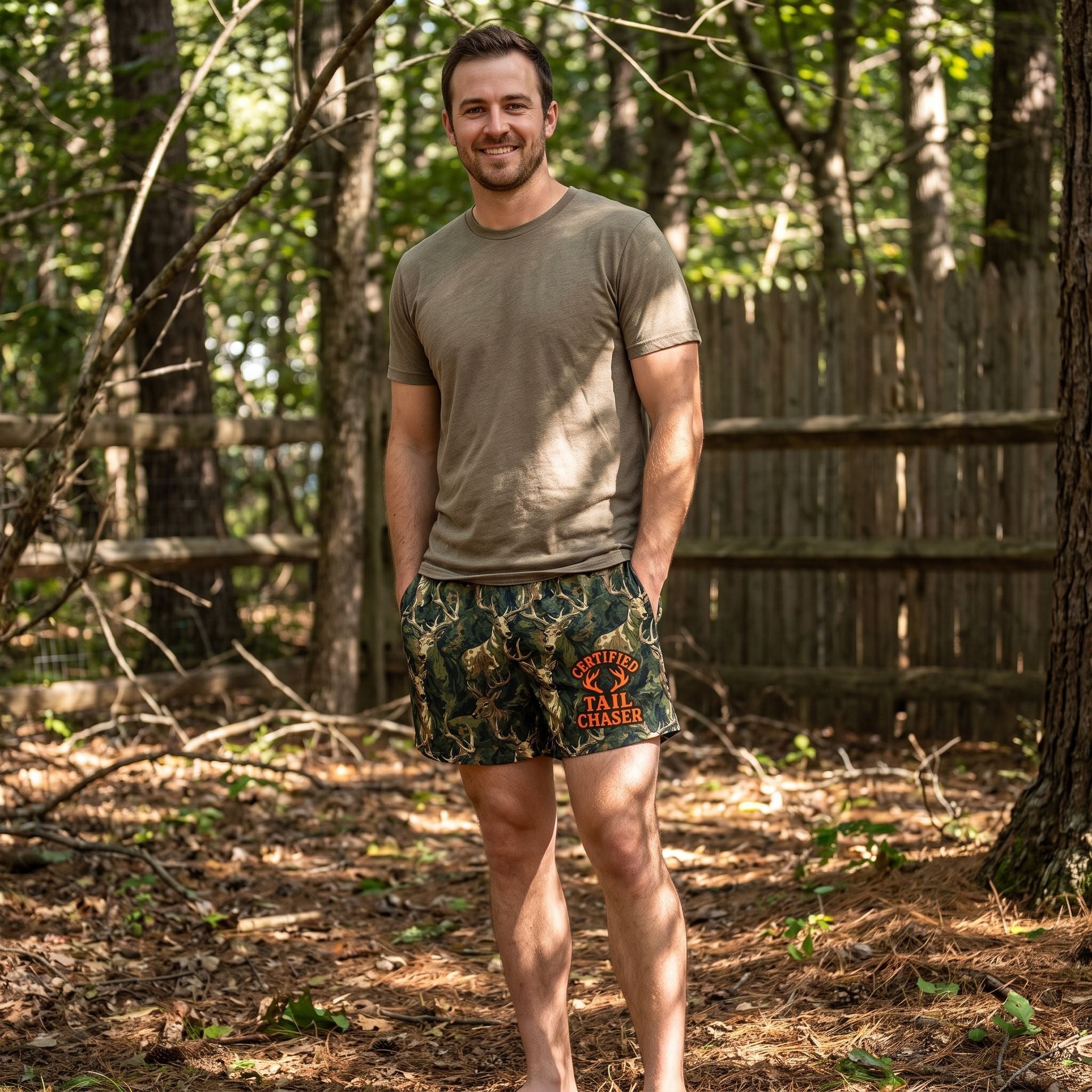 Male model outdoors in wooded area wearing camouflage deer boxers with sunlight filtering through trees, emphasizing comfort and fit.