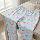 High-resolution close-up of Jellyfish Lounge Pants fabric showing vibrant ocean-inspired pattern of jellyfish on blue background.