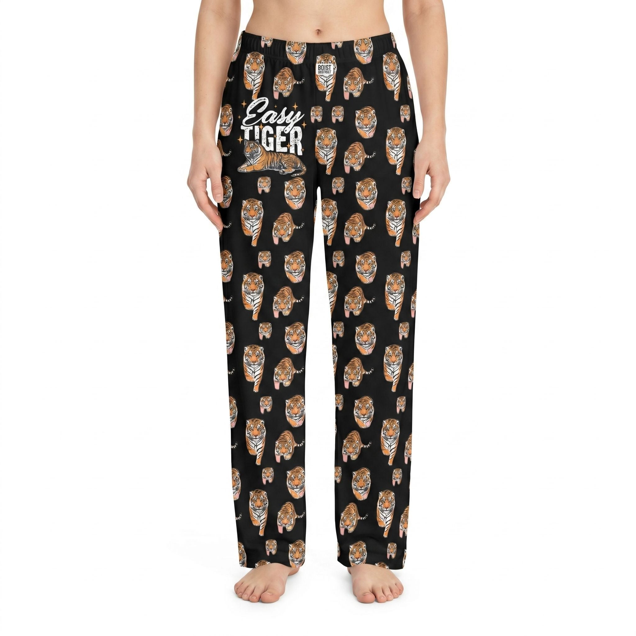 Model wearing Easy Tiger Lounge Pants with bold tiger print on black background, relaxed fit, centered on white studio background.