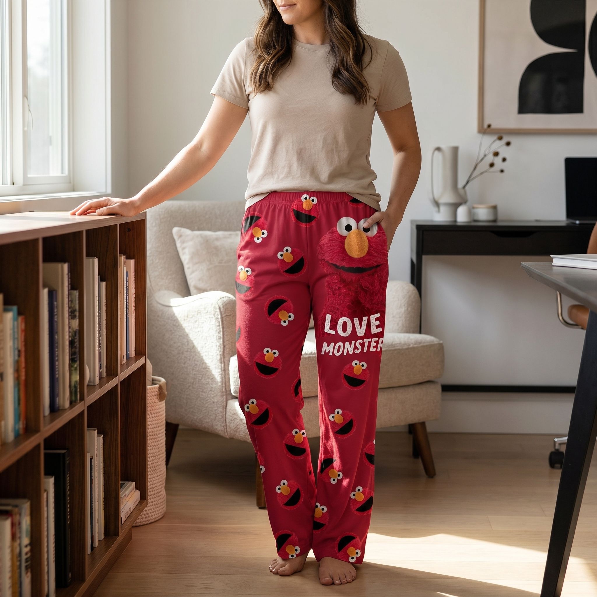 Bright pop art scene featuring Sesame Street Elmo Love Monster lounge pants with fun graphics and vibrant color palette.