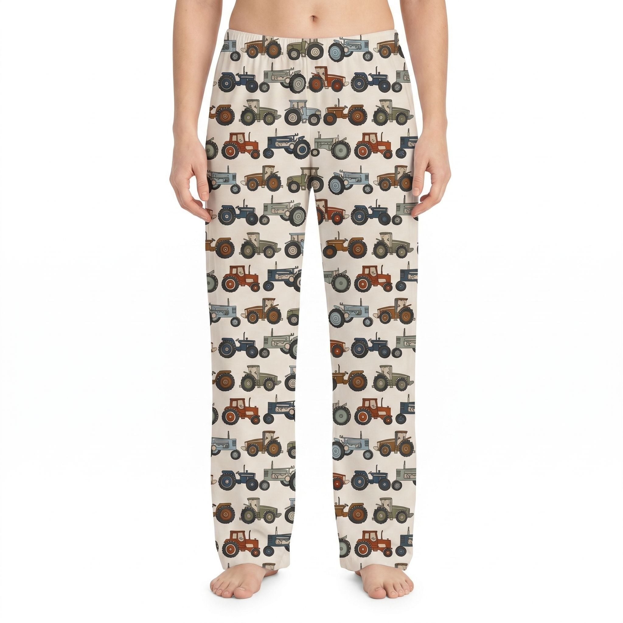 Model wearing Farm Truck Lounge Pants with retro tractor print in earthy tones on a white background.