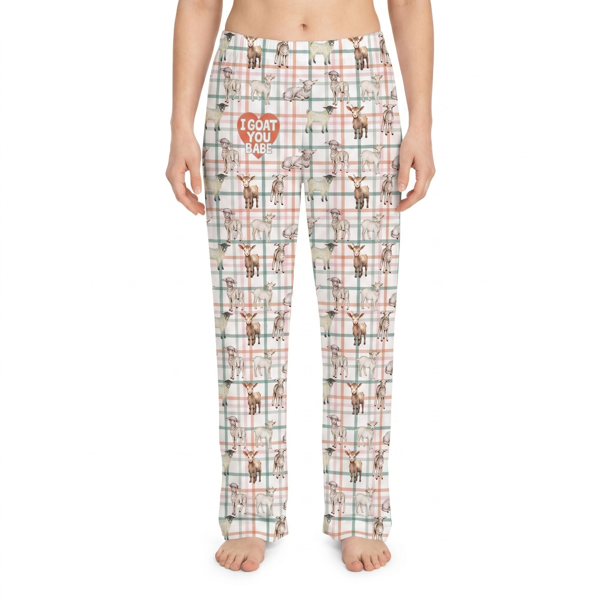 Model wearing I Goat You Babe Lounge Pants with all-over goat print on plaid background, cropped from waist to ankles against a white background.