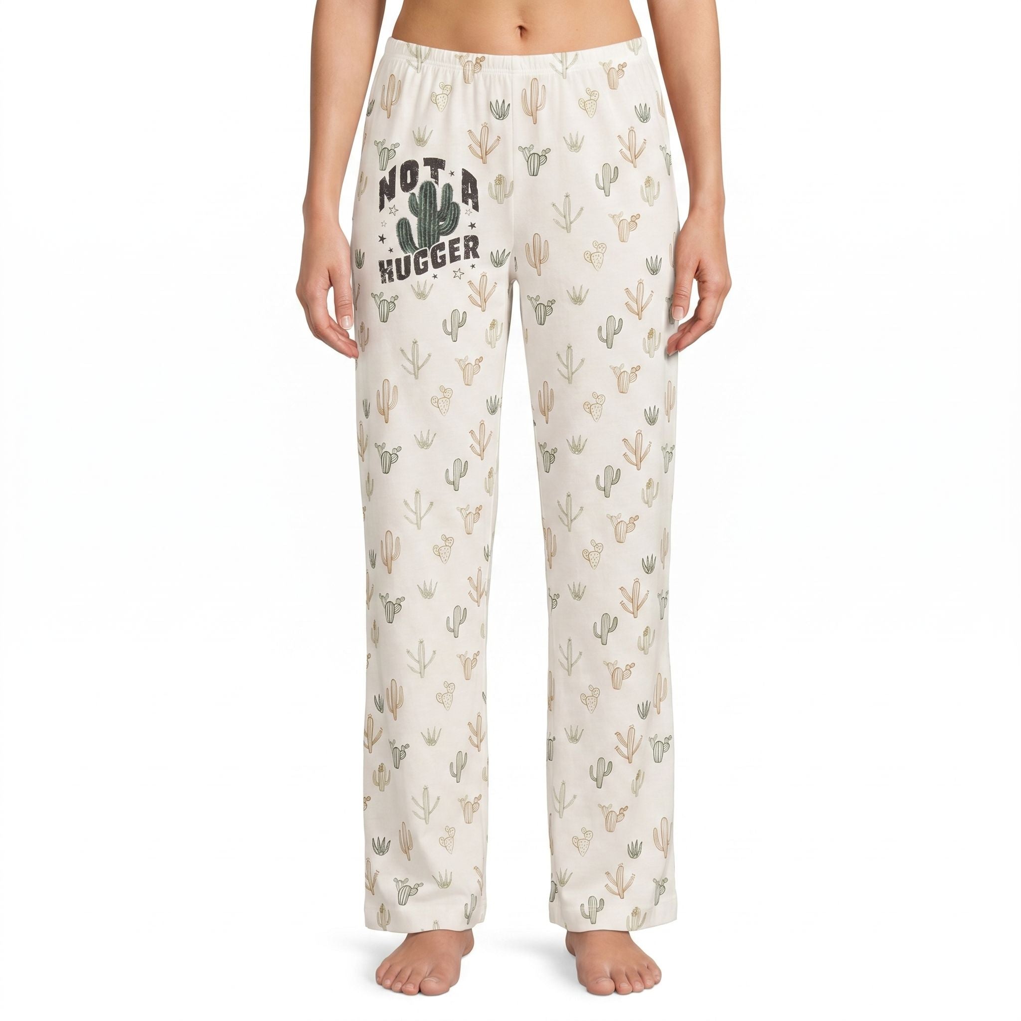 Model wearing Not A Hugger Cactus Lounge Pants with desert-inspired print and 'Not a Hugger' graphic, centered on white background.