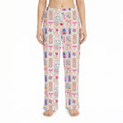 Model wearing Nurse Doodles lounge pants with medical icons on a white background, showcasing vibrant colors and relaxed fit.