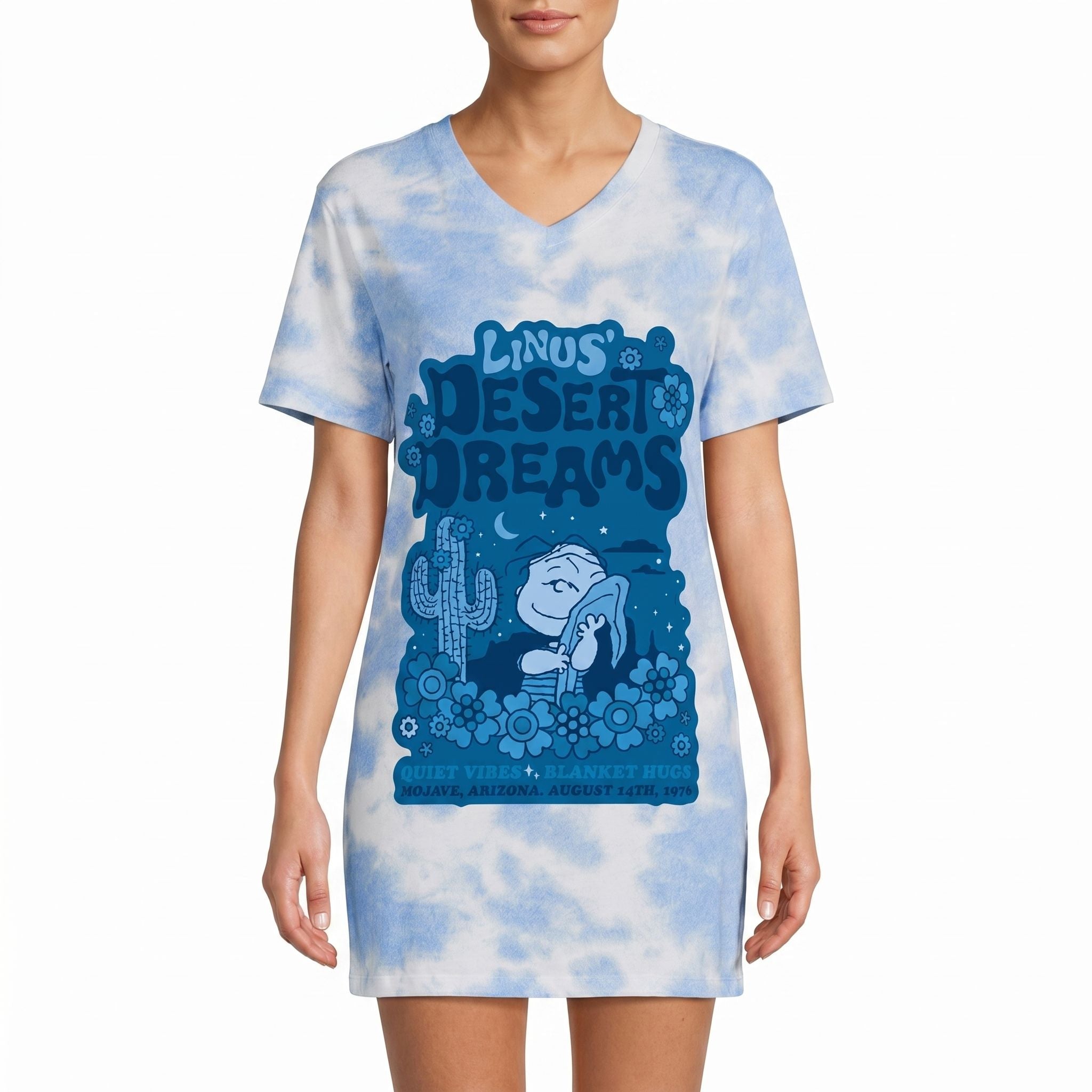Model wearing Peanuts Linus' Desert Dreams night shirt featuring retro desert scene and graphics, against a white background.