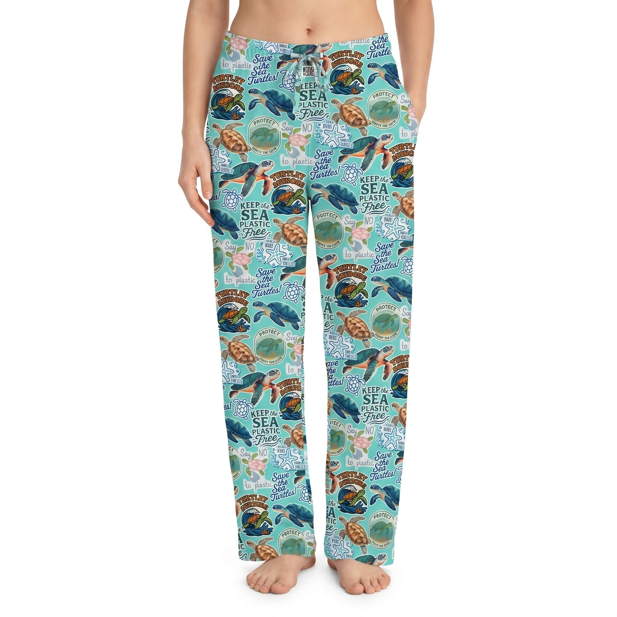 Model wearing Save the Sea Turtles Lounge Pants with ocean-inspired turtle print, centered on white background, vivid colors, natural fabric folds.