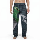 Model wears Sesame Street Oscar Grouch lounge pants with waistband and artistic print, cropped from waist to ankles against white background.
