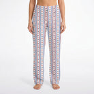 Model wearing USA Bows & Stars Lounge Pants with vibrant star and bow pattern on white background
