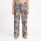 Model standing in lively living room wearing Cats Favorite People Lounge Pants, vibrant print clearly visible, natural light highlighting colors.