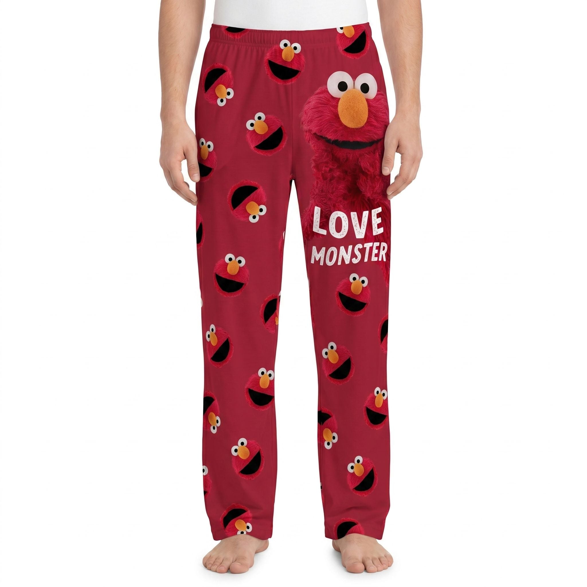 Close-up of Sesame Street Elmo Love Monster lounge pants with vivid colors and playful pop art design, bright background.