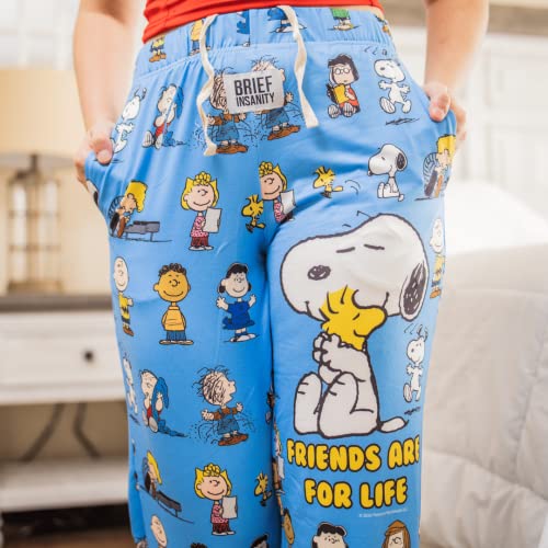 Front close up view of model wearing Snoopy Friends pajama lounge pants from the waist down