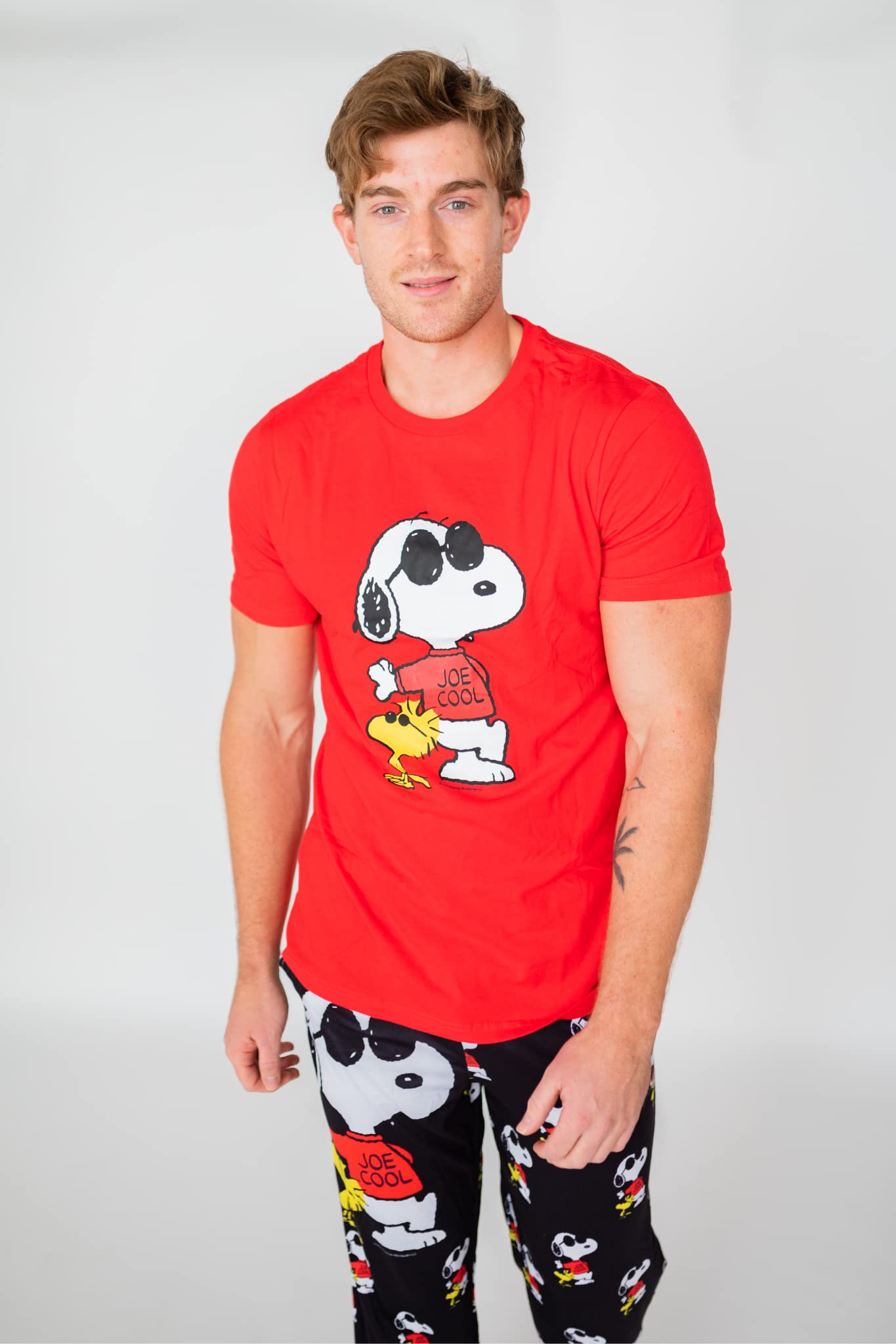 Image of male model standing and looking forward wearing Peanuts Snoopy Joe Cool short sleeve T-shirt (front view white background)