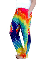 Waist down photo of model wearing Rainbow Tie-Dye pajama lounge pants side view #2 (white background)