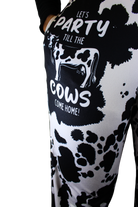 Party 'Till The Cows Come Home pajama lounge pants on model showing one leg (close up front view with hand in pocket)
