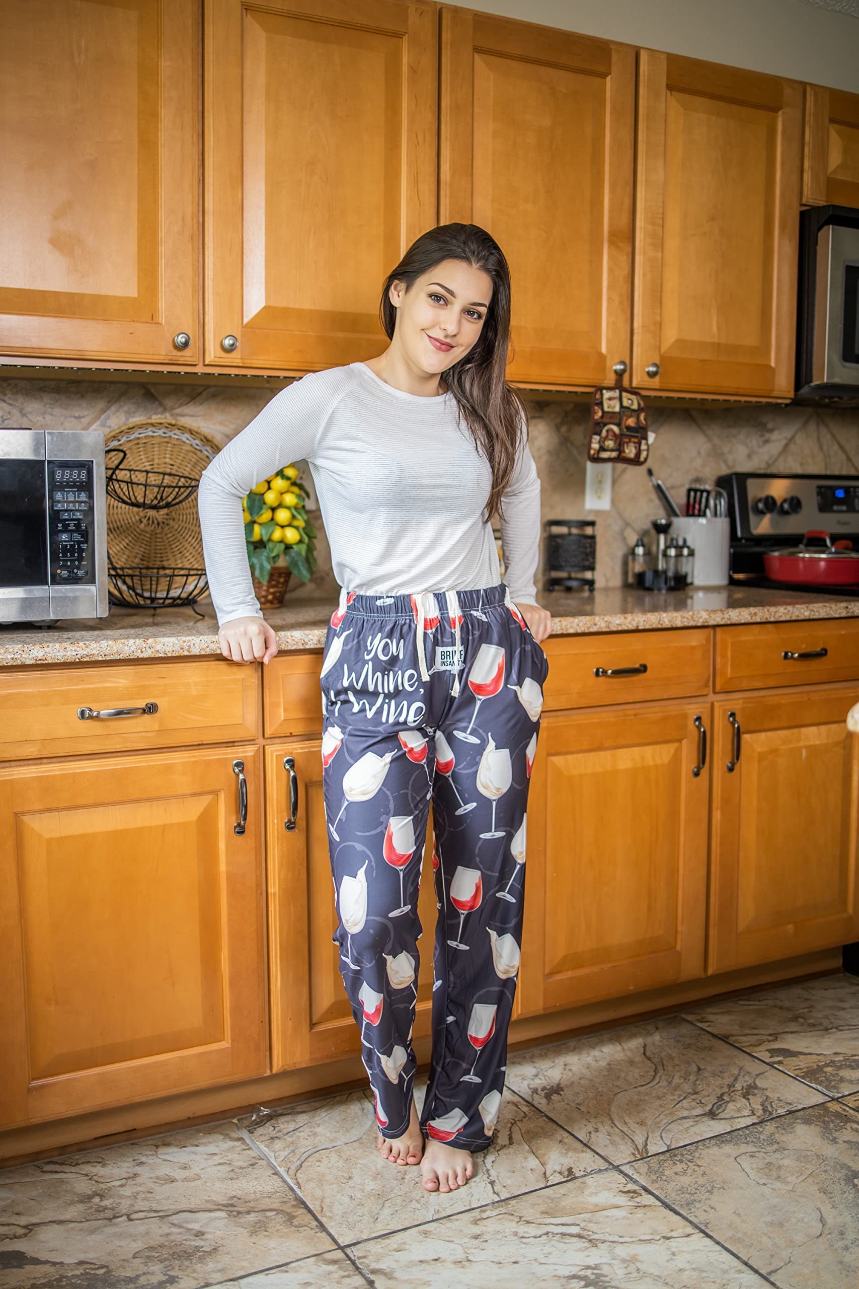 Female model leaning on kitchen counter wearing You Whine I Wine pajama lounge pants