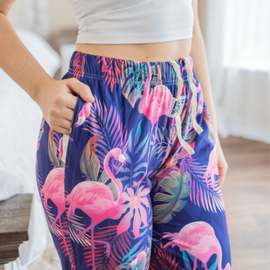 Flamingo pajama lounge pants side view with pockets and strings