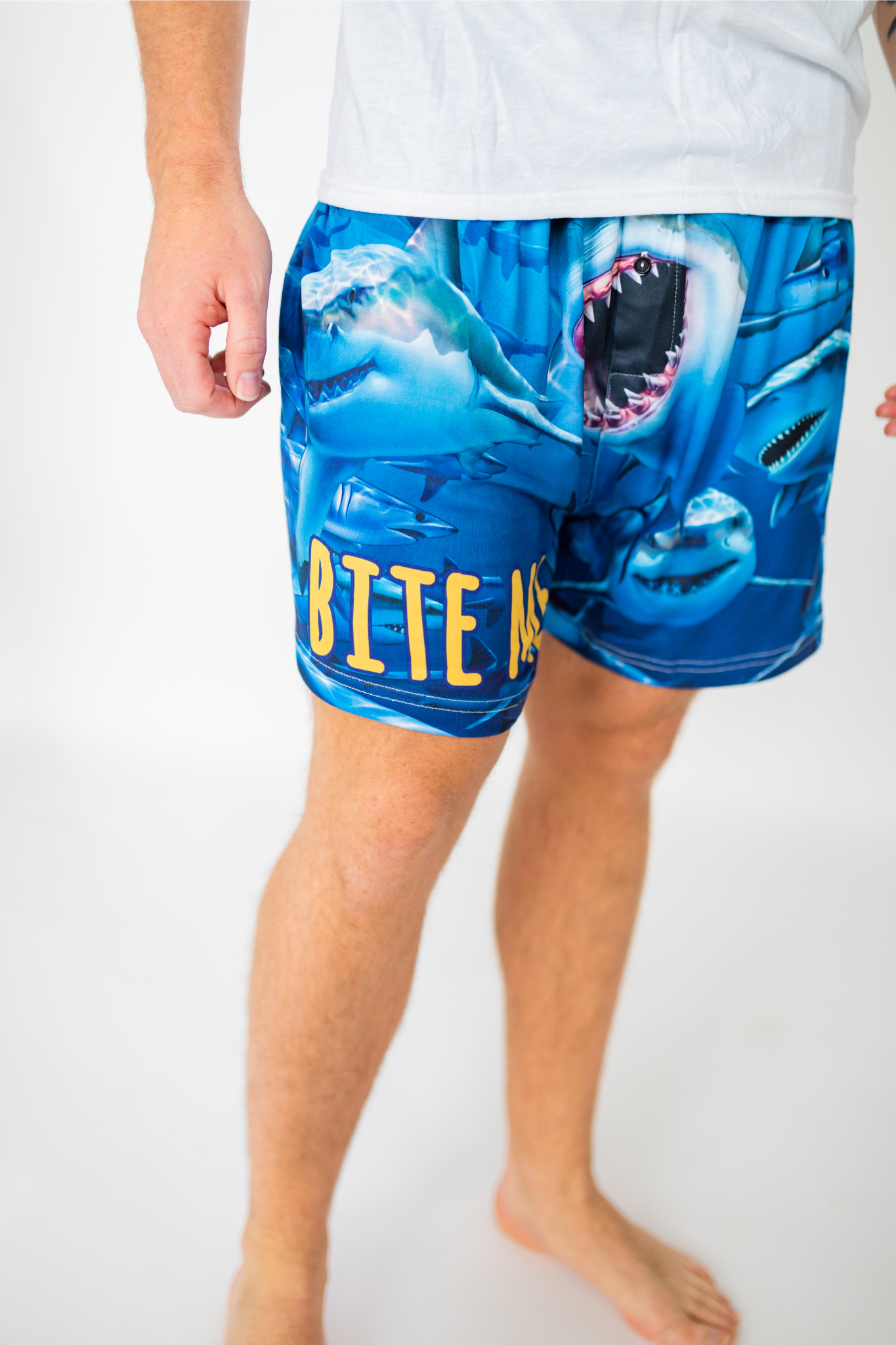 Waist down image of model wearing Bite Me Shark boxer shorts (front view white background)