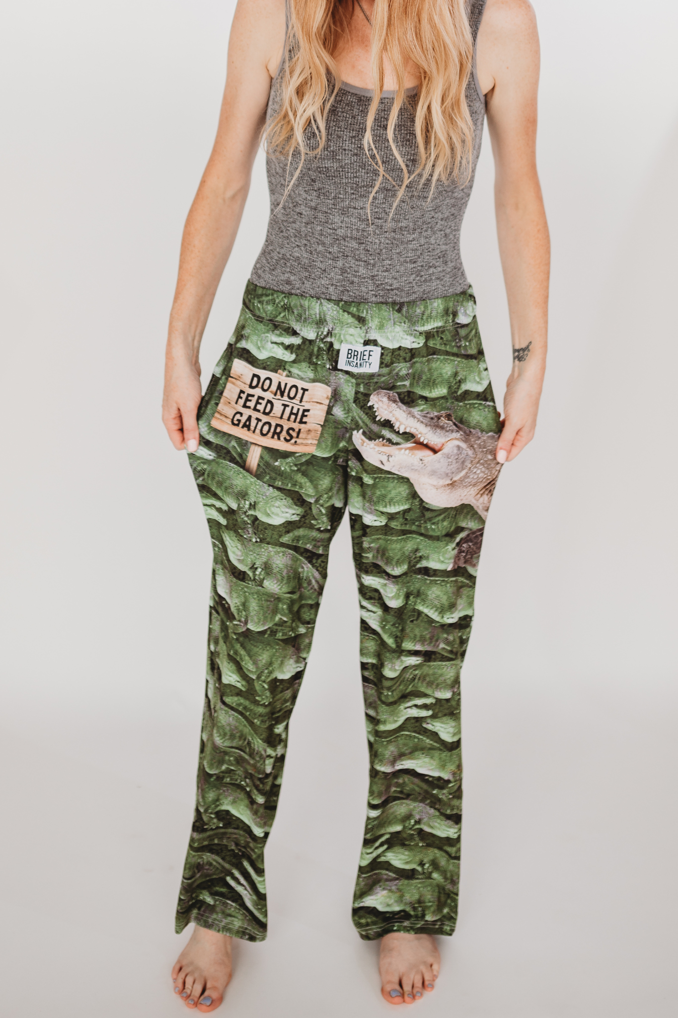 Image of model wearing Do Not Feed The Gators pajama lounge pants front view (white background)