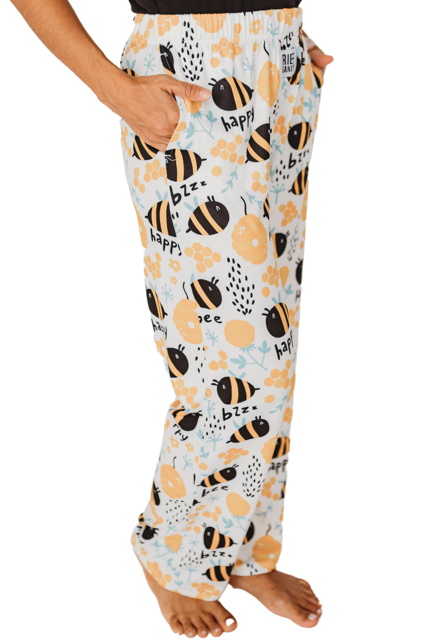 Waist down photo of model wearing Honey Bee pajama lounge pants side view (white background)