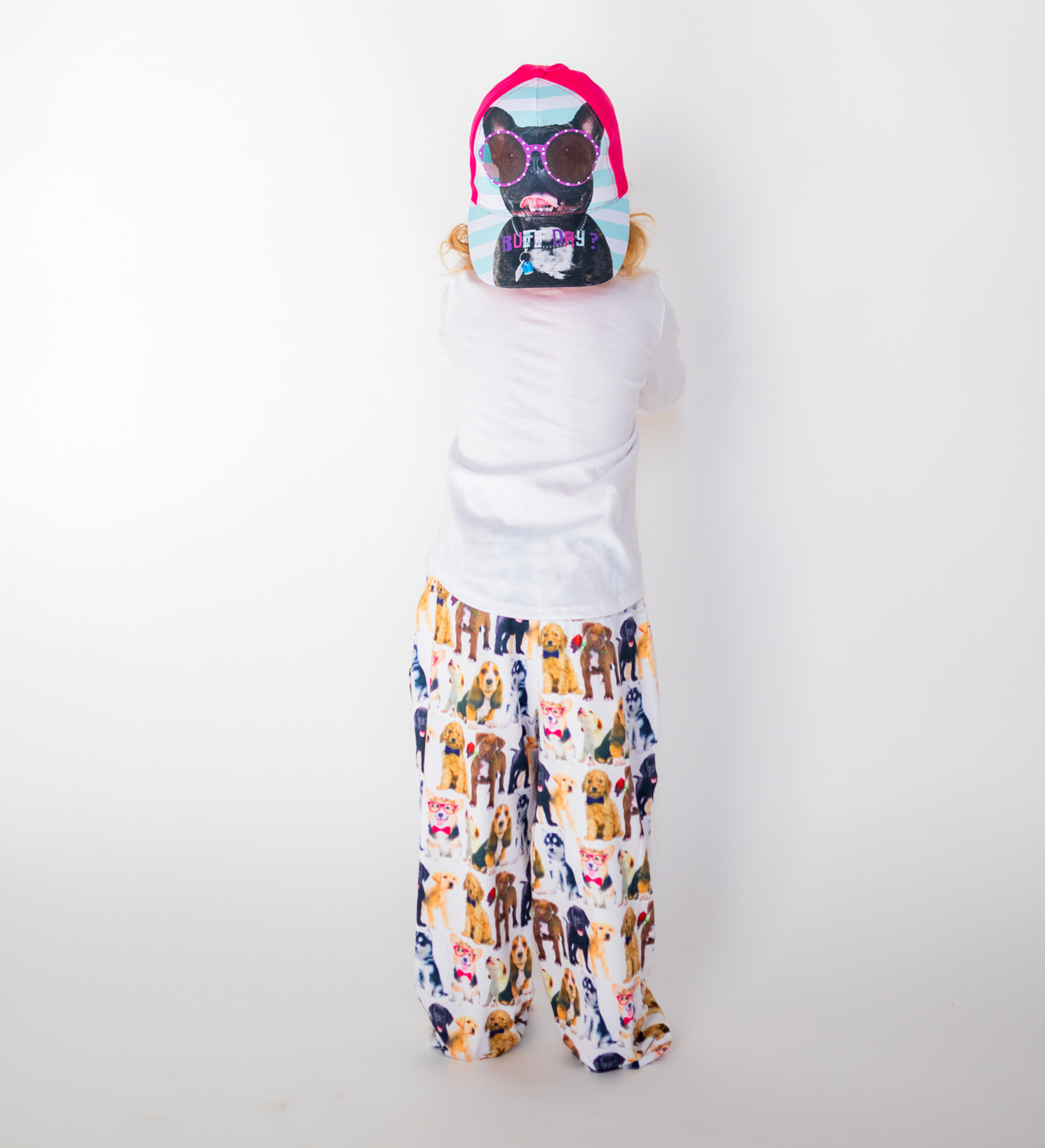 Toddler with back facing the camera while wearing Briefly Kids I Ruff You Pajama Lounge Pants and Kids I Ruff You Hat