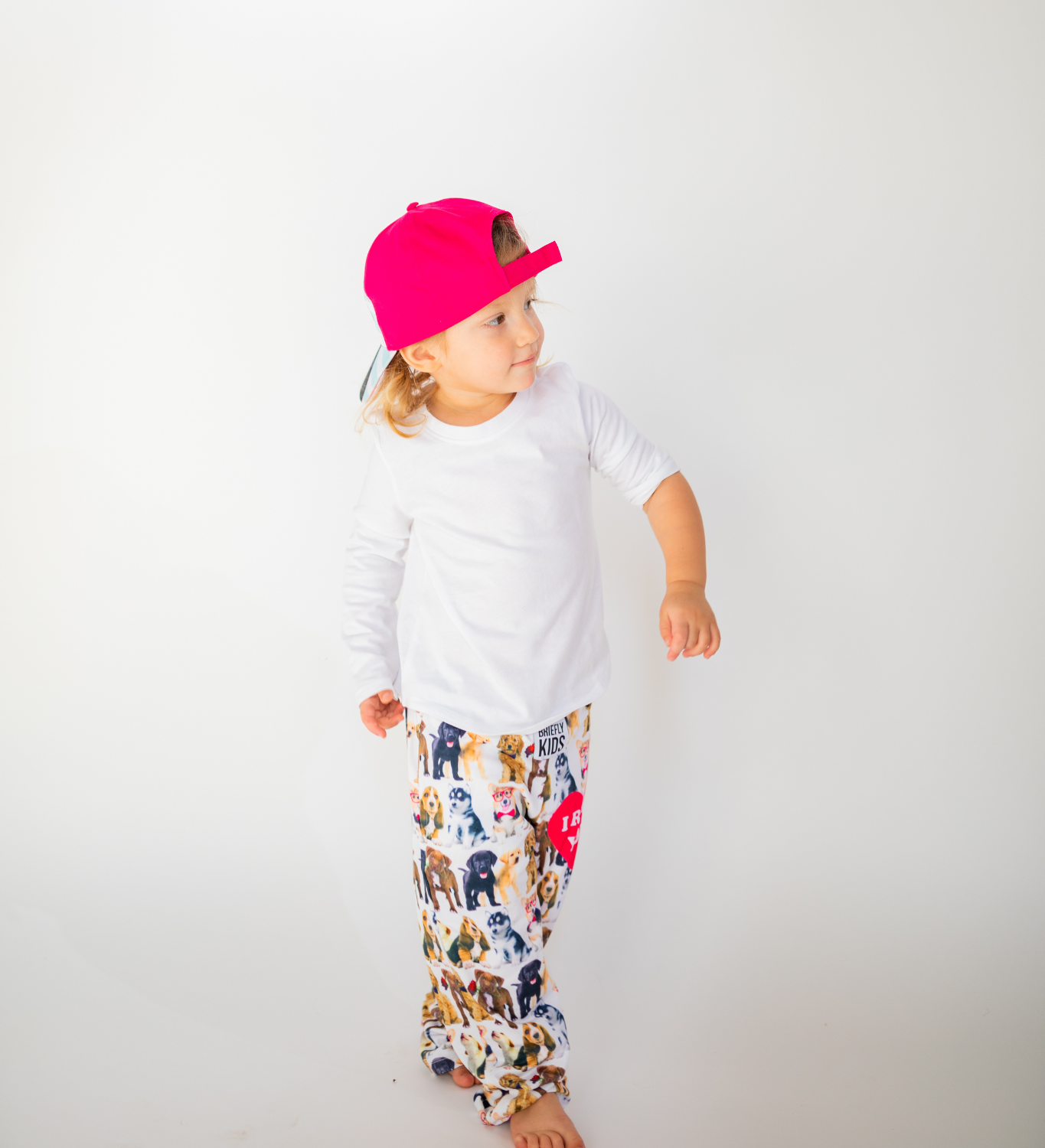 Toddler walking while wearing Briefly Kids I Ruff You Pajama Lounge Pants and Kids I Ruff You Hat