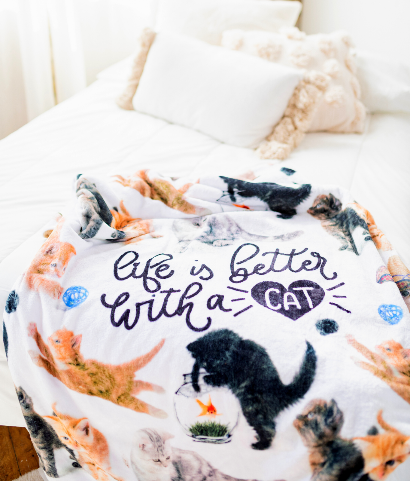 BRIEF INSANITY Life Is Better with A Cat Throw Blanket laid out on white bed 