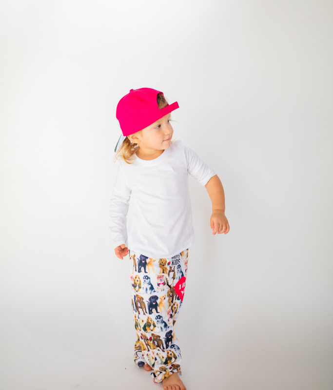 Image of little girl model standing and wearing Ruff Day kids cap backwards (front view white background)